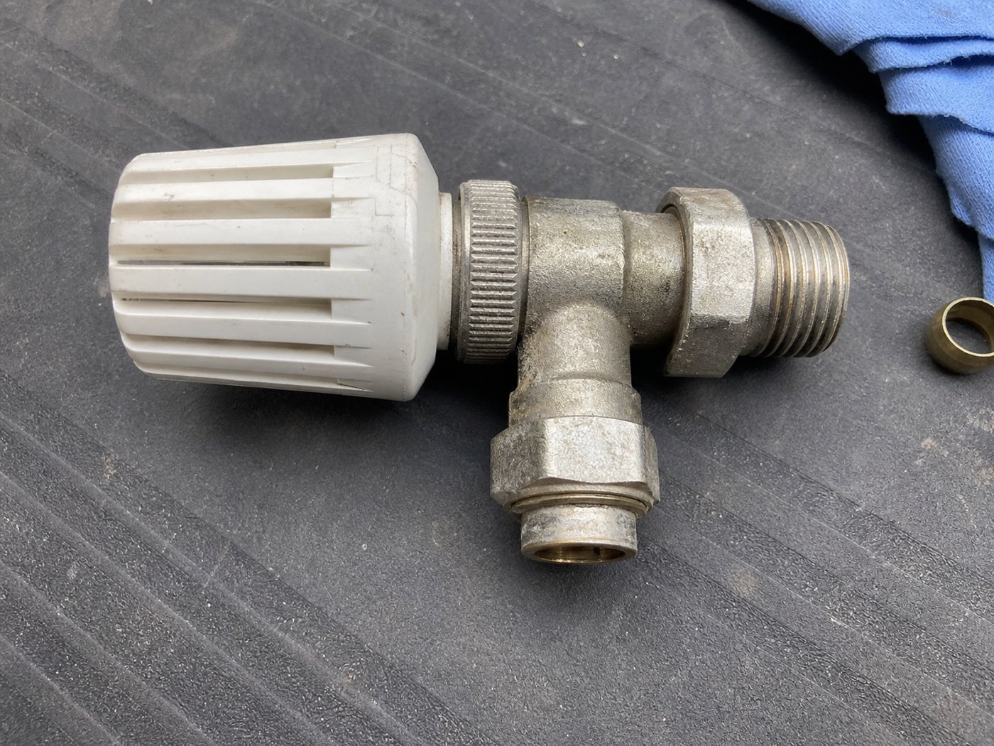 Thermostatic radiator valve on a workbench